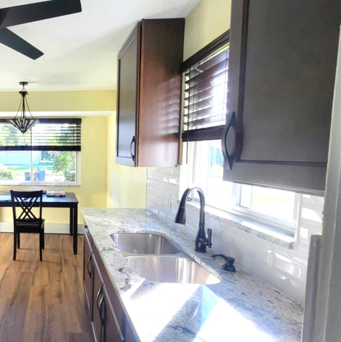 Completed Valden's kitchen renovation with dark cabinetry and stone counters